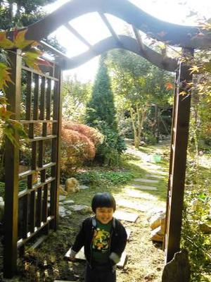 Hiromu Under the Curved Garden Arch