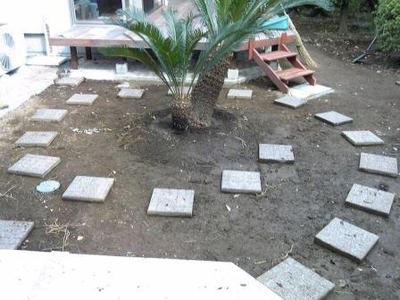 A garden makeover project: laying the tiles.