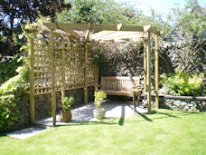 Copyright image: a lovely corner pergola with radiating rafters.