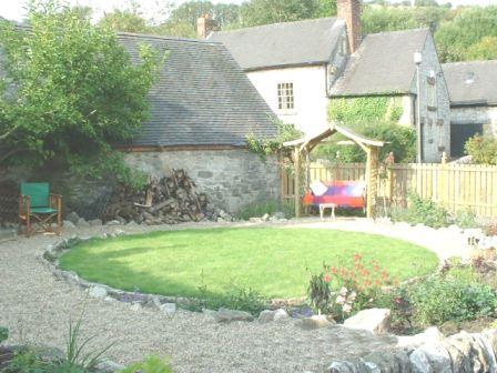 Copyright image: Garden makeover - a gorgeous swinging arbour in a small cottage garden design. 