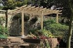 The lean-to pergola, sometimes called patio pergola, entry pergola, attached pergola or carport.