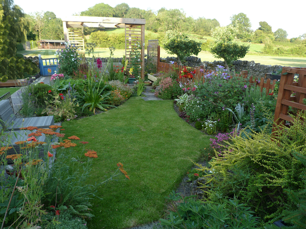 Copyright image: small garden design with modern pergola.