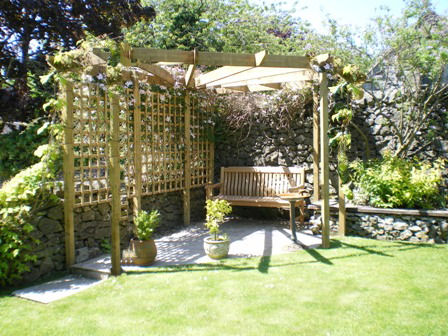 Copyright image:  A corner pergola and patio combination. 