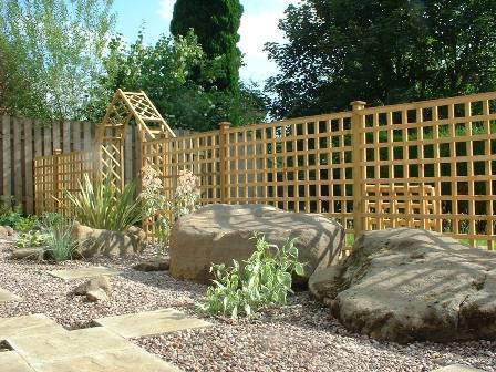 Copyright image: Garden makeover - a garden design plan showing arches with trellis, architectural planting and large boulders.