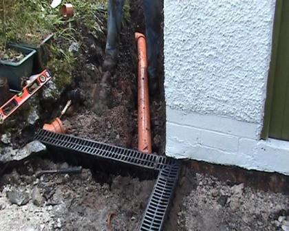 Copyright image:  Installing drains under the patio. 
