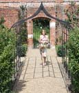 Ogee metal pergola walkway for creating a romantic, rose-covered walkway.