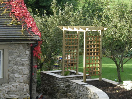 Copyright image: A pergola arch that can be made into a seated arbour.