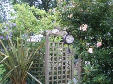 Copyright image: Pergola design made from the free pergola plans, the rafters draped in beautiful climbing plants.