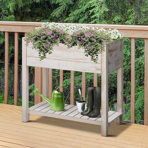 Lovely wooden raised bed with a shelf.